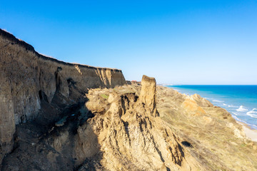 Mountain landslide in an environmentally hazardous area. Large crack in ground, descent of large...