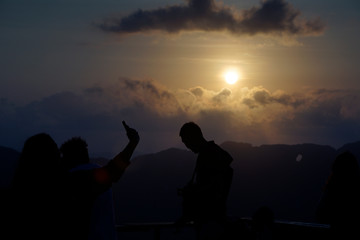 Fototapeta na wymiar People silhouette with twilight sky in a morning