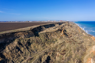 Mountain landslide in an environmentally hazardous area. Large crack in ground, descent of large...