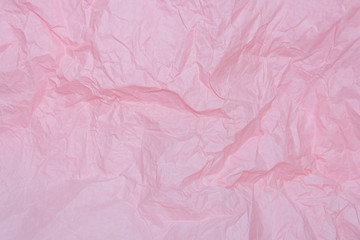 Pink crumpled sheet of paper