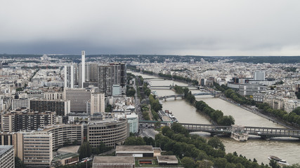 View of the city of Paris, France from top of Eiffel Tower on a cloudy day