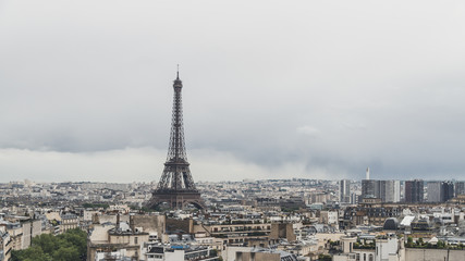 Fototapeta premium Eiffel Tower over buildings of Paris, France, viewed from Arc de Triomphe