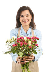 Beautiful female florist with bouquet of flowers on white background