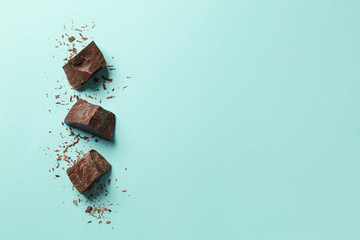 Sweet tasty chocolate on color background