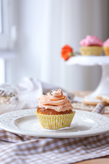 Tasty Easter cupcake on plate