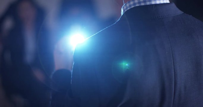 4K Confident speaker giving a presentation to colleagues in business meeting. Slow motion.