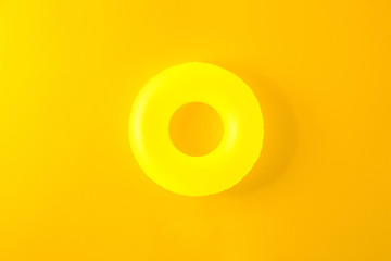 Inflatable ring on color background