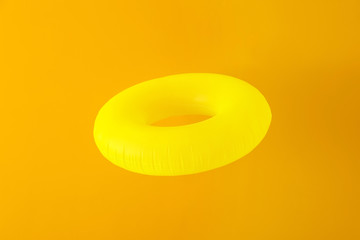 Inflatable ring on color background