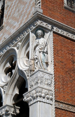 Sculpture of Archangel Raphael with Tobias, detail of the Doge Palace, St. Mark Square, Venice, Italy, UNESCO World Heritage Sites 