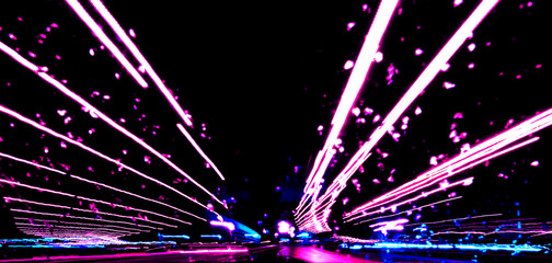 Blurred background with Cars light trails on a curved highway at night. Night traffic trails....