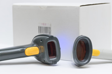 The man held scanner and scan barcode with laser in white background.