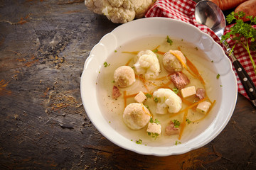 Bowl of German spring soup on a rustic table