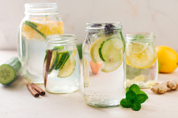 Fototapeta na wymiar Bottle with detox water with cucumber, lime and mint