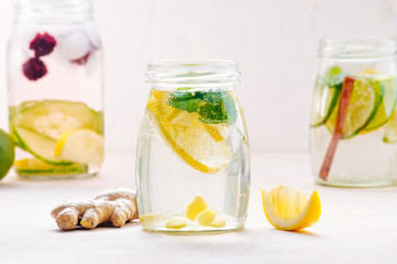 Bottle with detox water with lemon, ginger and mint