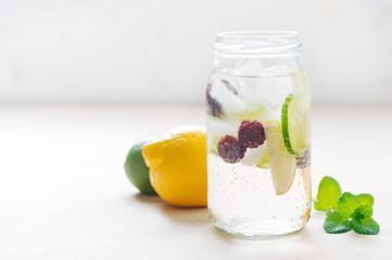 Detox water with cucumber, raspberry and mint