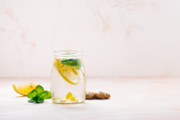 Bottle with detox water with lemon, ginger and mint