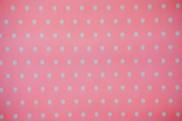 Pink Fabric and White Tiny Polka Dots. background and texture