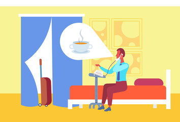 businessman thinking about coffee calling to reception making order guest sitting bed hotel room interior flat horizontal full length