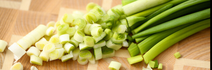 Cook holds knife in hand and cuts on cutting