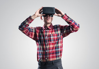 Guy in mask experiencing virtual reality as new entertainment device