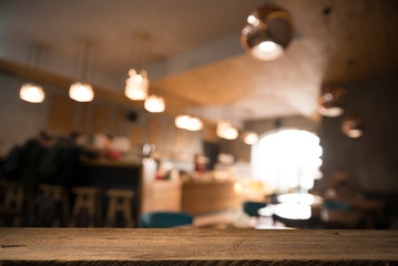 Fototapeta na wymiar blurred background of bar and dark brown desk space of retro wood