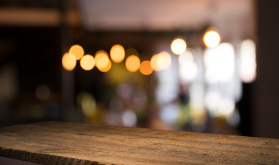 Fototapeta premium blurred background of bar and dark brown desk space of retro wood