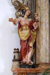 Statue of Saint Barbara on the altar of Our Lady in the Church of Assumption of the Virgin Mary in Pokupsko, Croatia - obrazy, fototapety, plakaty