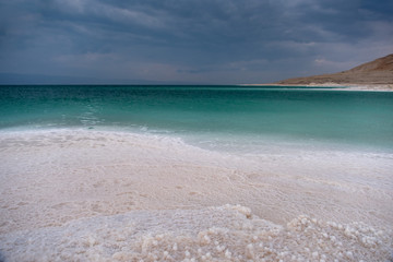 Beautiful green white salty coastline of Dead sea in Jordan