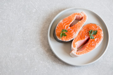 fresh fish. fresh salmon steaks in a light plate