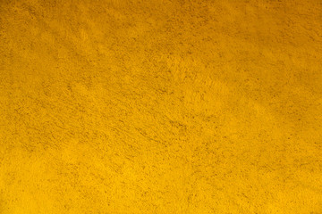bright yellow concrete wall. rough surface texture