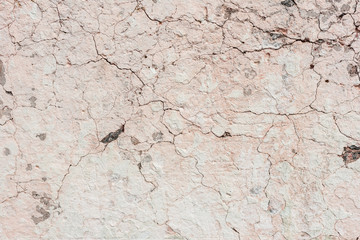Wall fragment with scratches and cracks