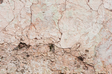 Wall fragment with scratches and cracks