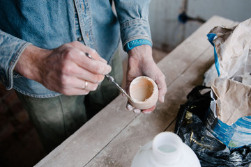 Manually mixing gypsum and water