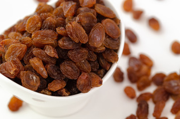 Raisins on white background,top view.
