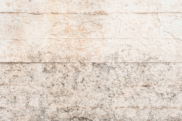 Wall fragment with scratches and cracks