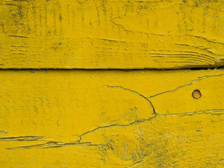Old wooden background of boards with cracked and peeling paint