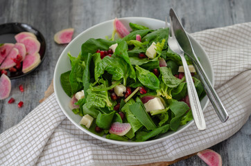Spinach salad on white plate