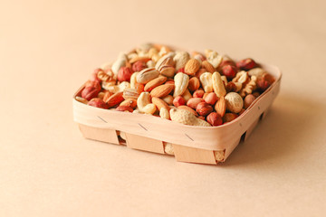 Dried fruits and nuts mix in a wooden bowl. 
