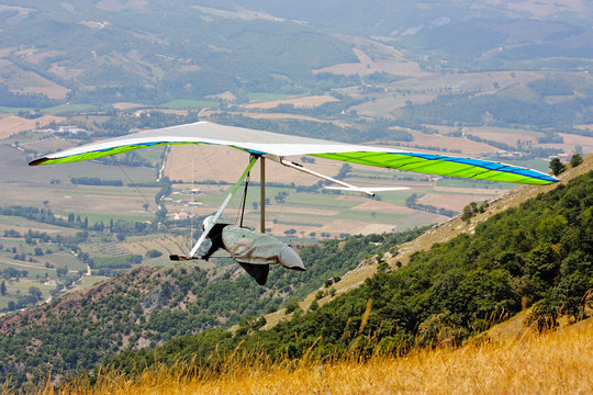 Hang glider pilot in Italian mountains