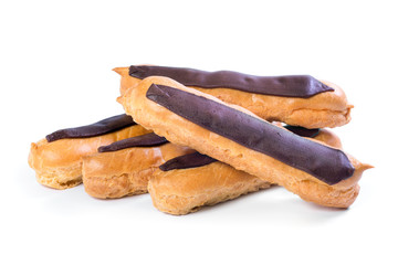 Fresh French eclairs with custard inside on a white background. Dessert