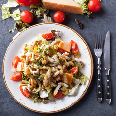 Seafood salad with vegetables on a plate. Top view. Closeup