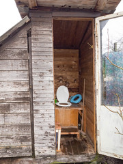 an old toilet wooden outhouse privy in the garden