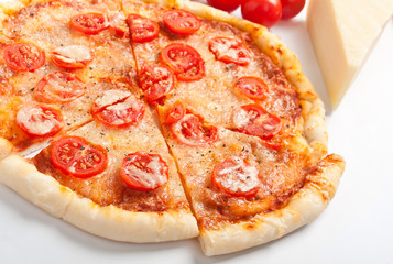 Sliced Pizza Margarita with tomatoes 