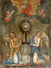 Eucharistic adoration monstrance with the Blessed Sacrament, with angels, altarpiece in Church of...