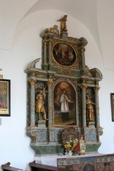Fototapeta na wymiar Altar of Saint John of Nepomuk in Church of Birth of Virgin Mary in Svetice, Croatia
