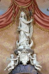 Fototapeta na wymiar Assumption of the Virgin, statue on the altar of Saint Michael in Church of Assumption of Virgin Mary in Zakanje, Croatia 