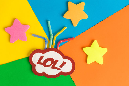 Lol text in speech bubble with drinking straws and stars against multicolored background abstract.