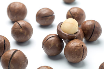 Macadamia nuts on white background. Close-up.