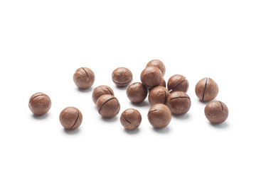 Pile of macadamia nuts isolated on white background
