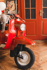 Retro red scooter  in oldschool vintage interior with air balloons